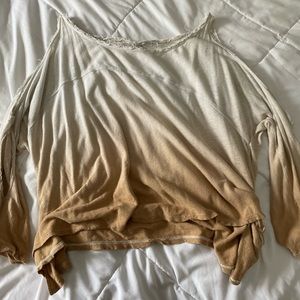 A white and gold ombré flowy shirt.